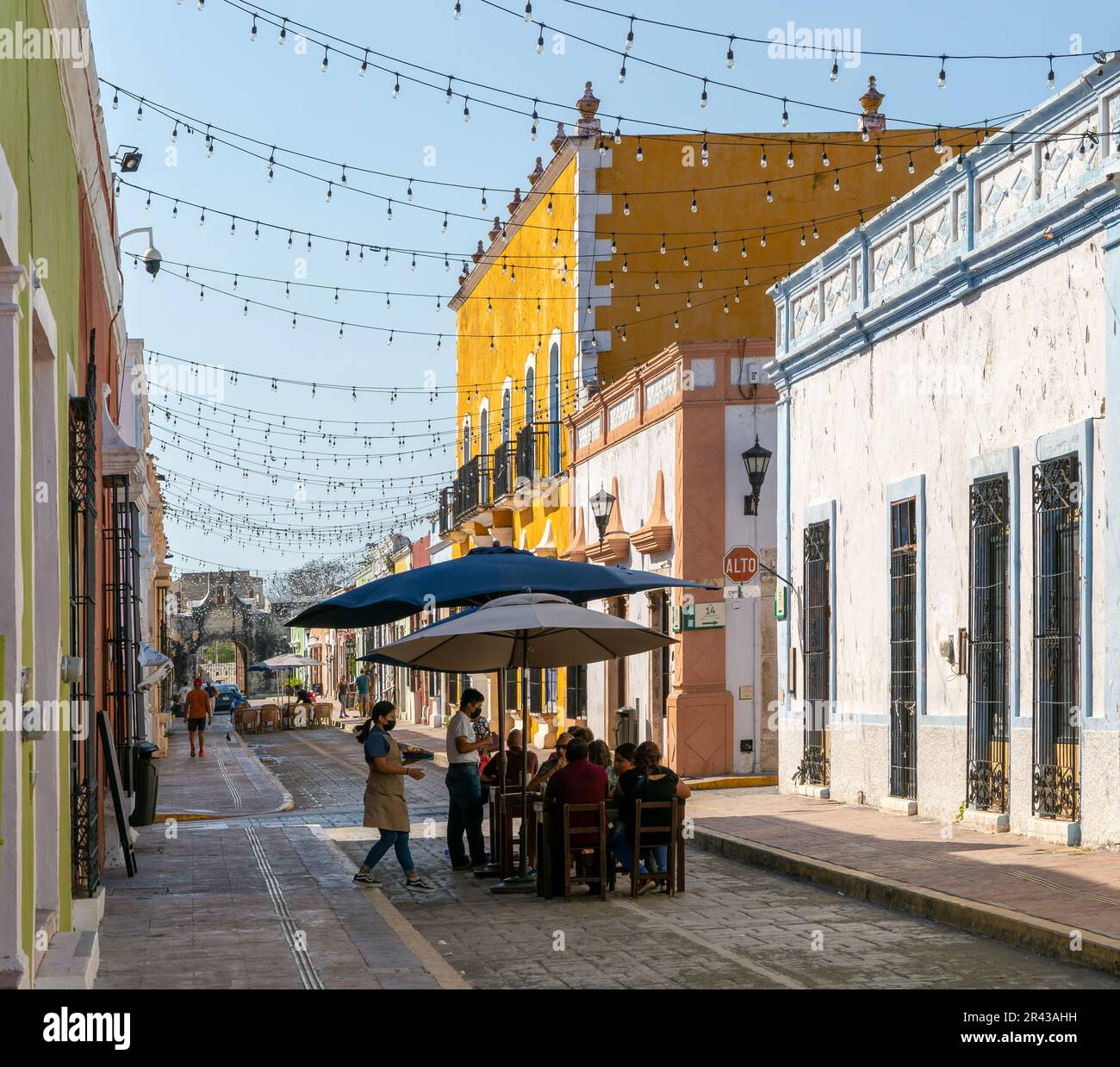 Restaurant tables in historic street of Spanish colonial buildings, Campeche city, Campeche State, Mexico Stock Photo