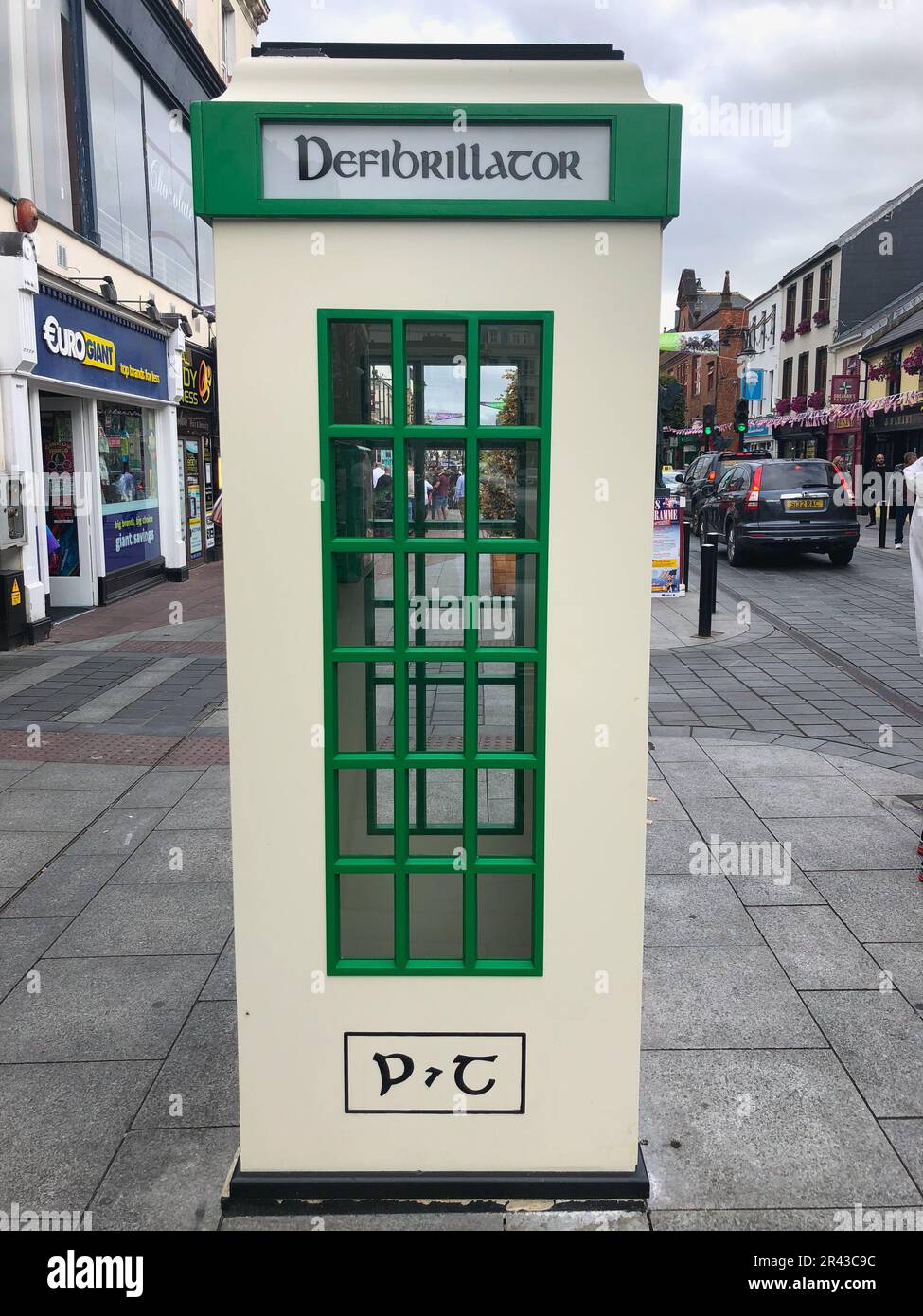 Killarney, Ireland - July 15, 2018: Traditional irish phone box is house a defibrilator Stock Photo