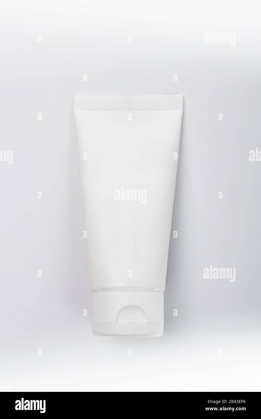 Moisturizer hand cream white plastic tube mockup on white trandy ...