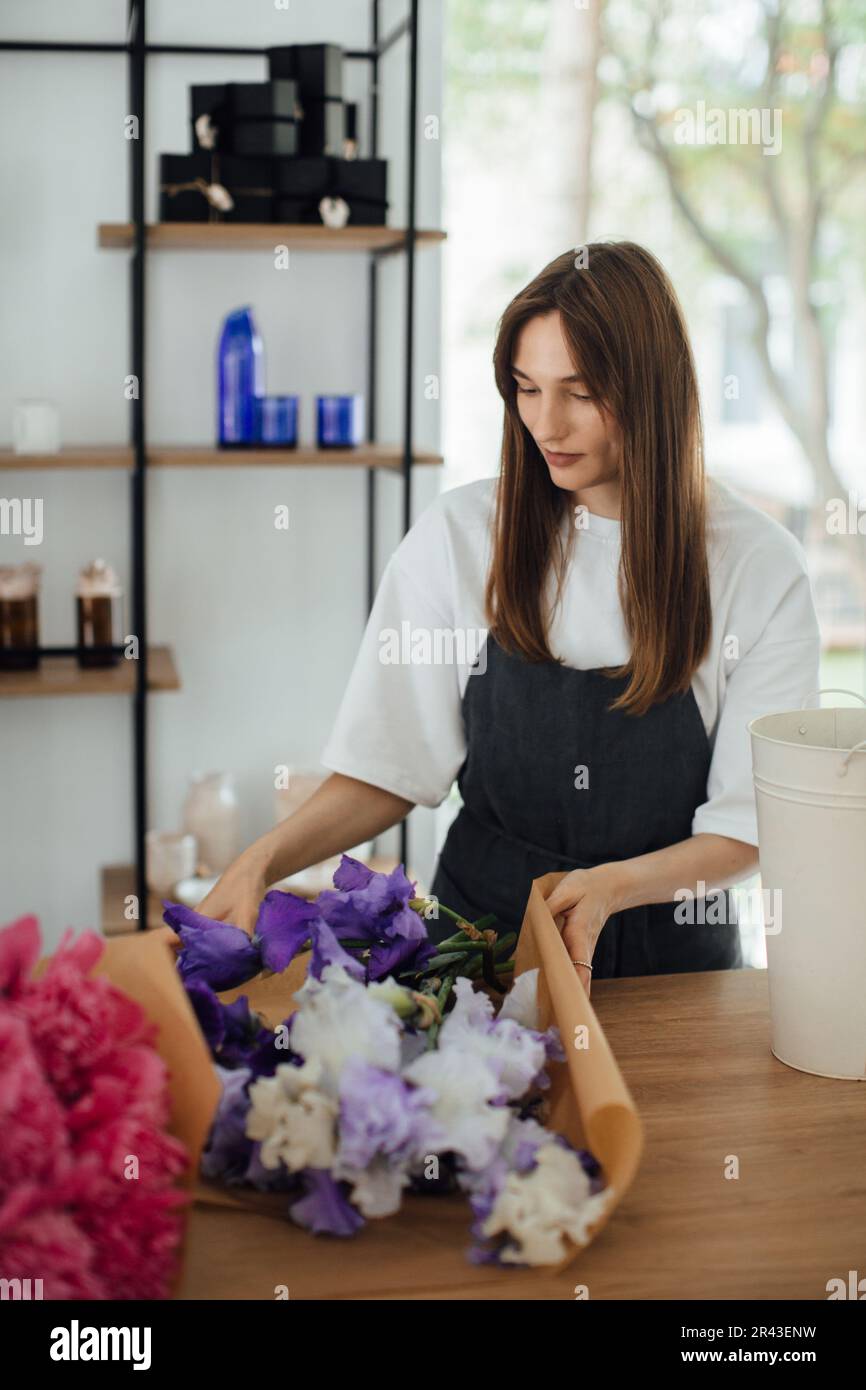 Owner working at flower shop - stock photo Stock Photo