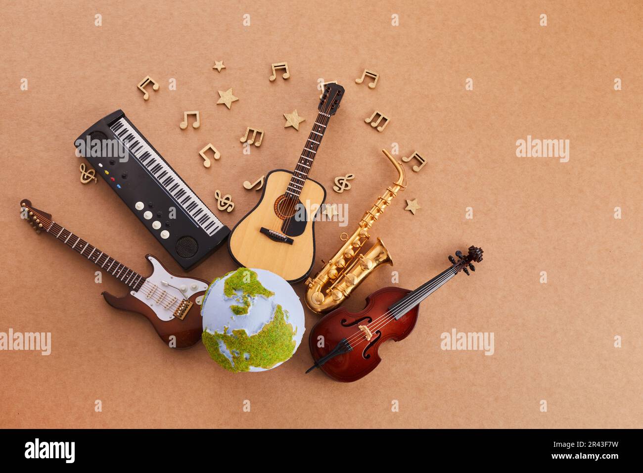 Happy world music day. Musical instruments with globe background. Stock Photo