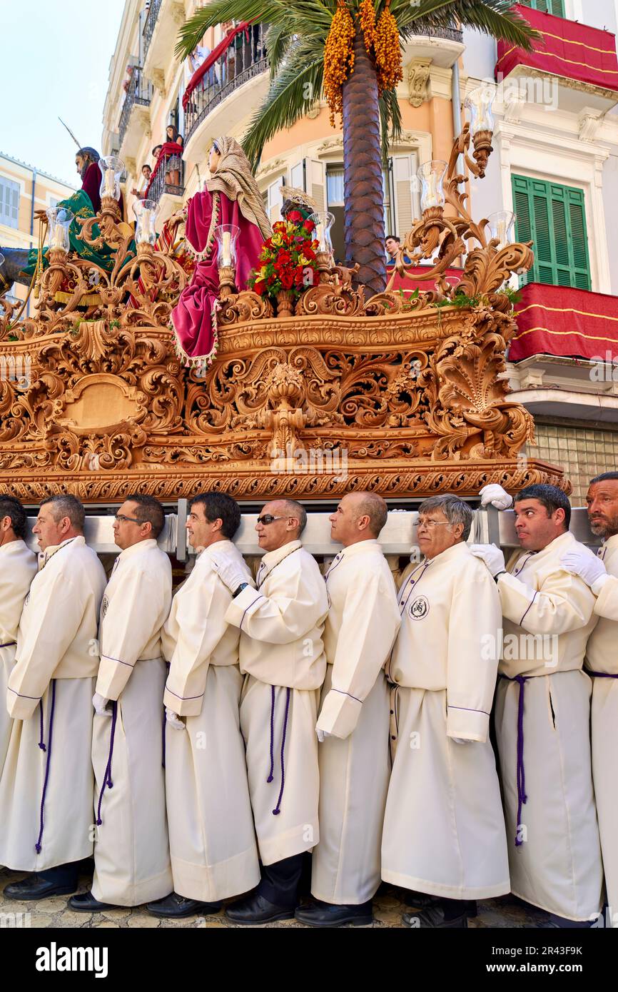 Andalusia Spain. Procession at the Semana Santa (Holy week) in Malaga. Holy statues mounted on floats Stock Photo