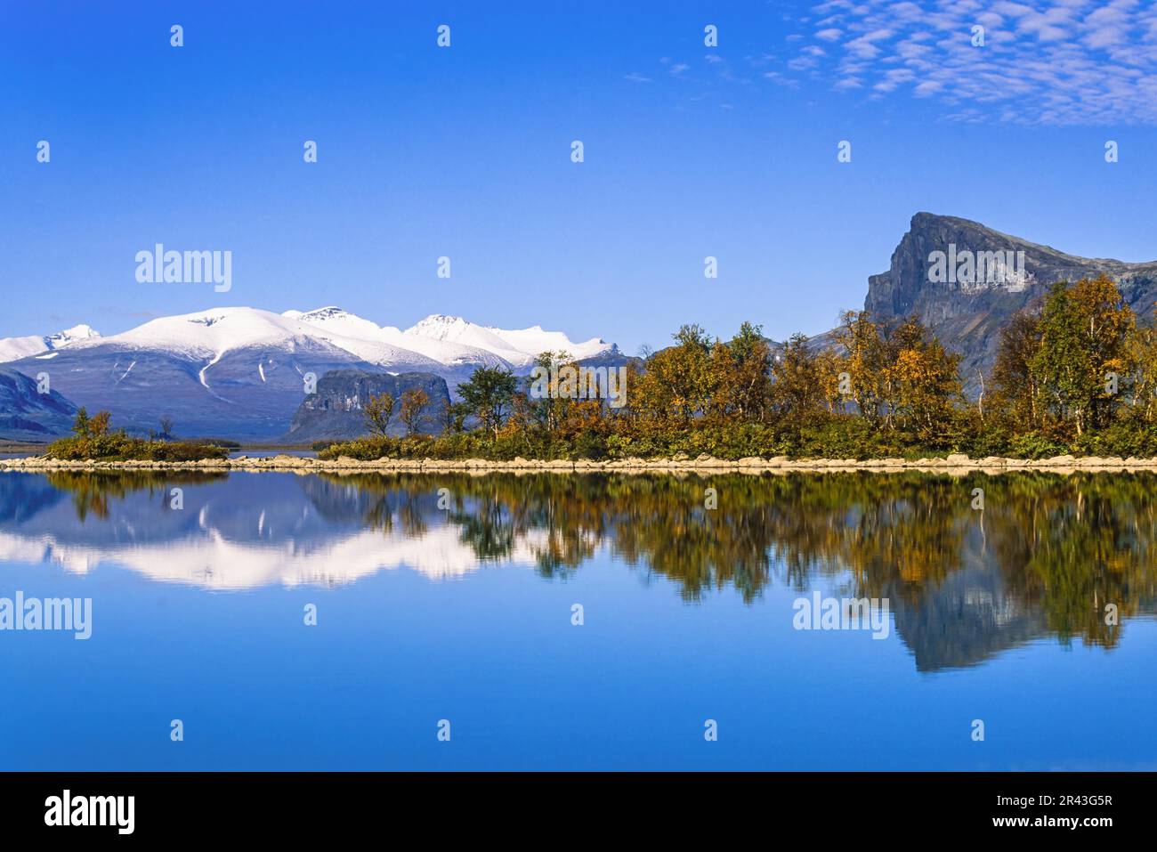 Scenic view at Lake Laitaure in rapa valley at Sarek national park with autumn colors and snow capped mountains, Kvikkjokk, Lapland, Sweden Stock Photo