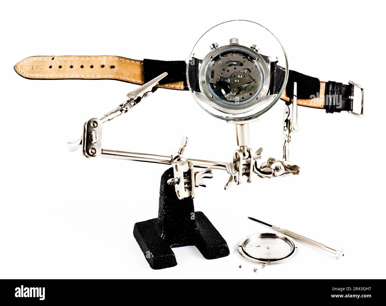 Elegant watch repaired using a magnifier with three handles Stock Photo