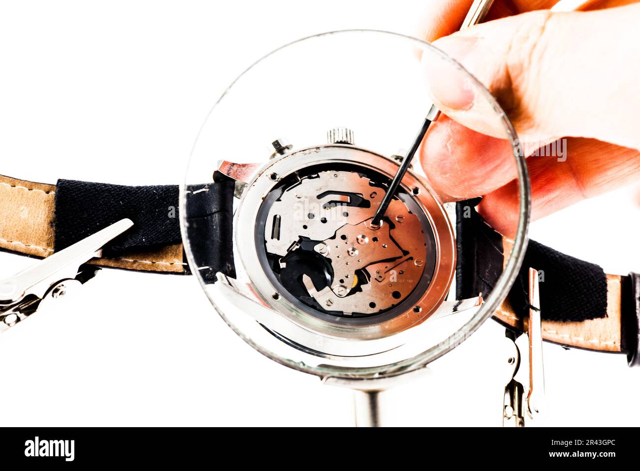 Elegant watch repaired using a magnifier with three handles Stock Photo