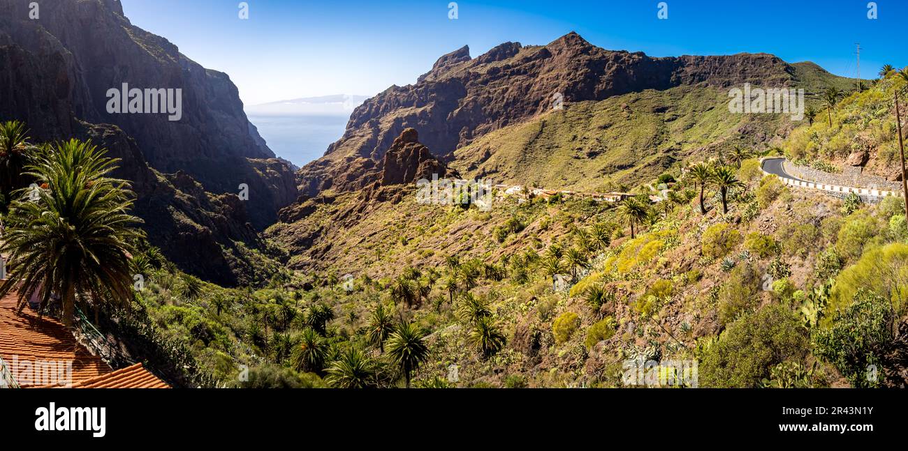 Scenic mountain road TF-436 that winds its way through Tenerife's famous Barranco de Masca gorge, offering panoramic views of the Masca village with R Stock Photo