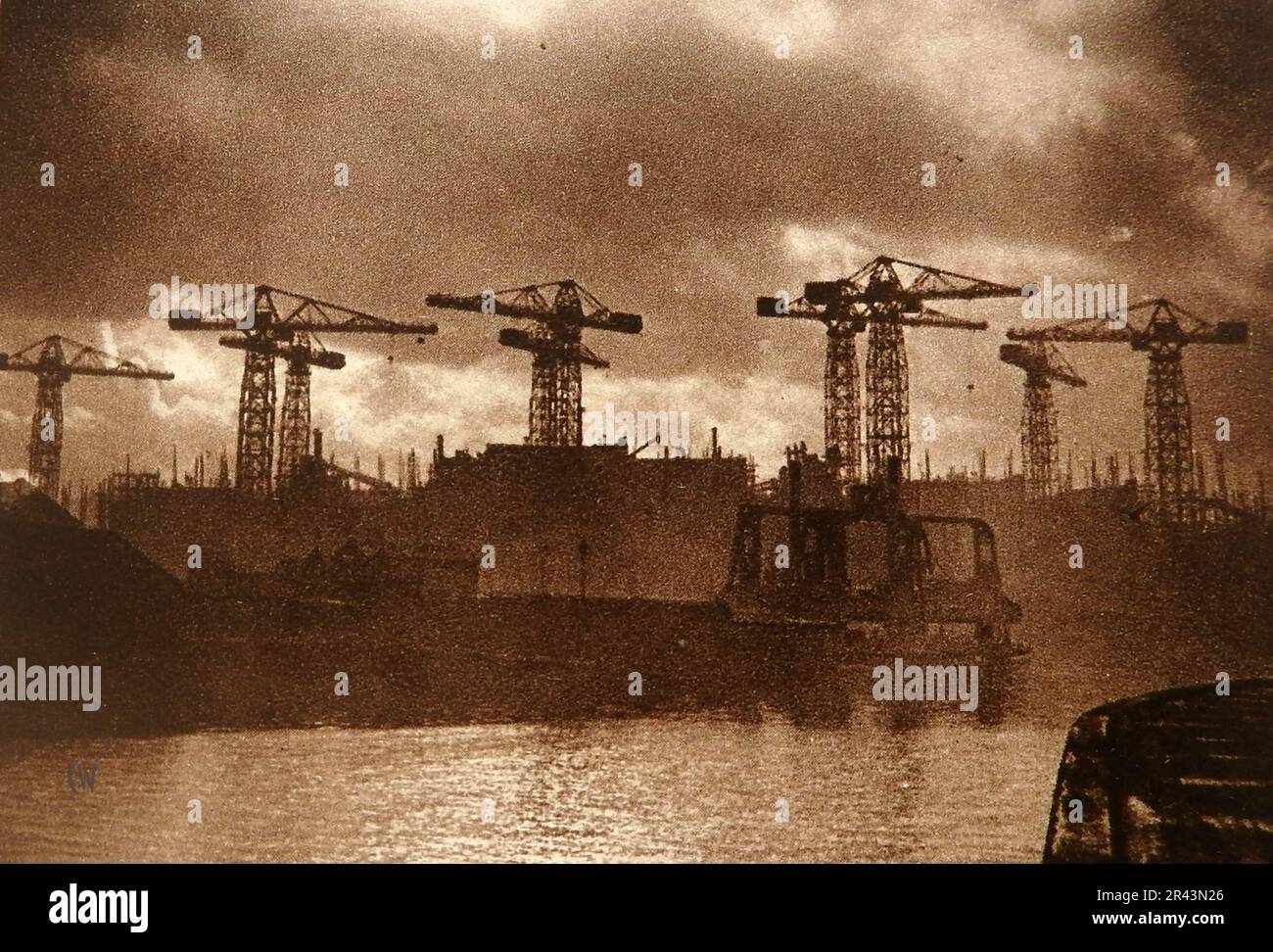 A 1939 old photograph of shipyard cranes on the Clyde, Glasgow, Scotland. Stock Photo