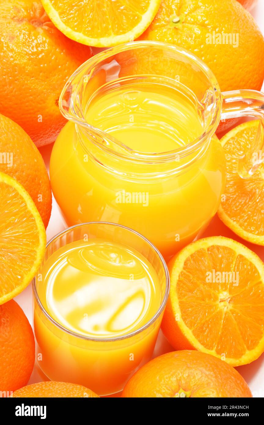 https://c8.alamy.com/comp/2R43NCH/glass-and-jug-of-orange-juice-and-fruits-2R43NCH.jpg
