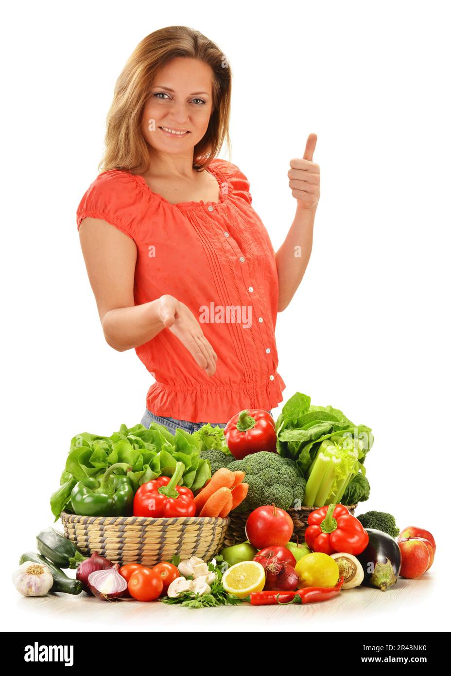 Young woman with variety of vegetables isolated on white background ...
