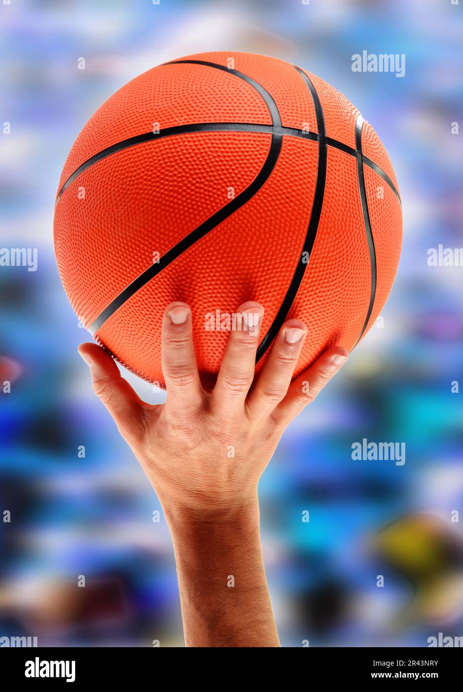 Hands catching basketball Stock Photo