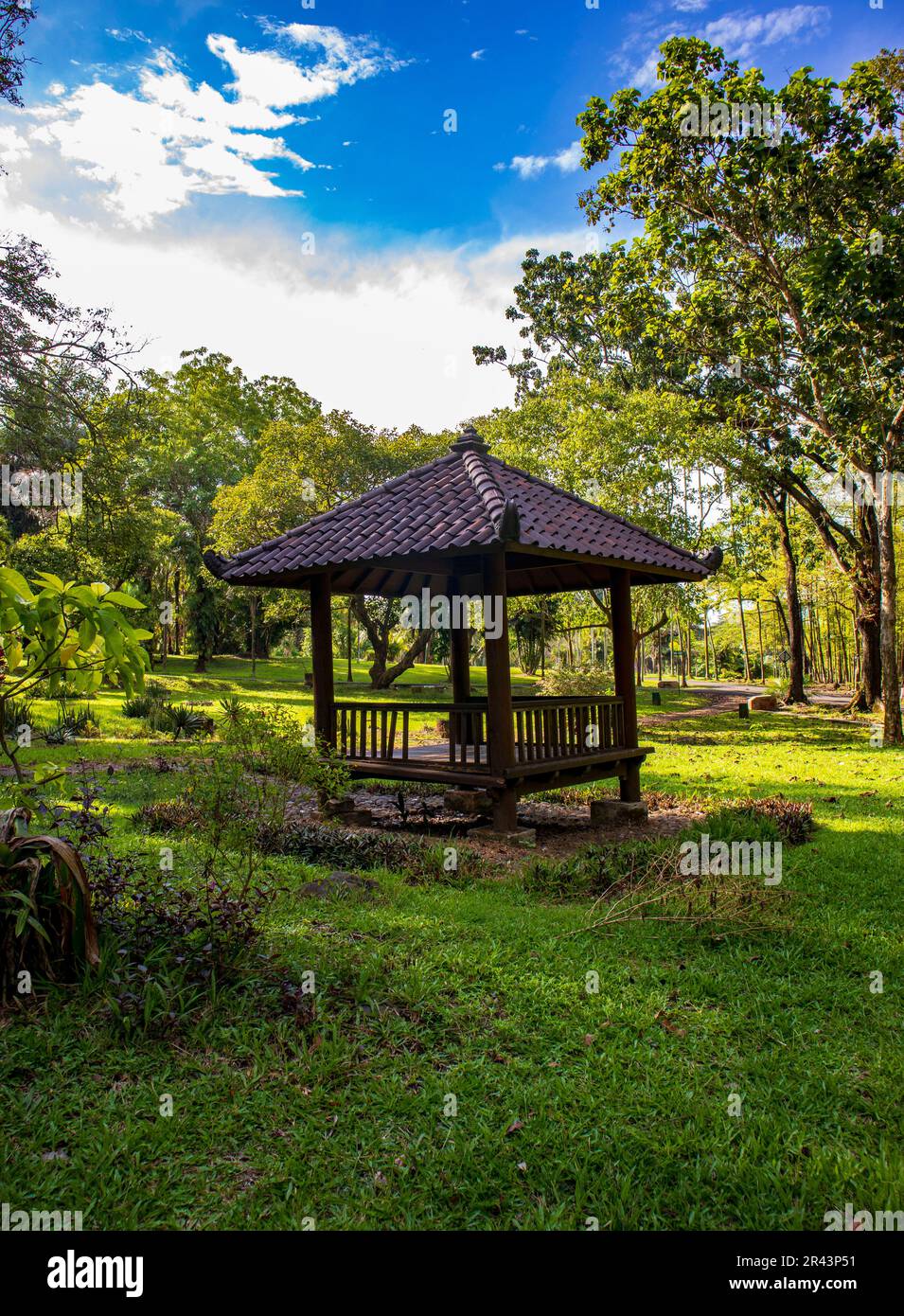 Small gazebos around the garden for people to rest Stock Photo - Alamy