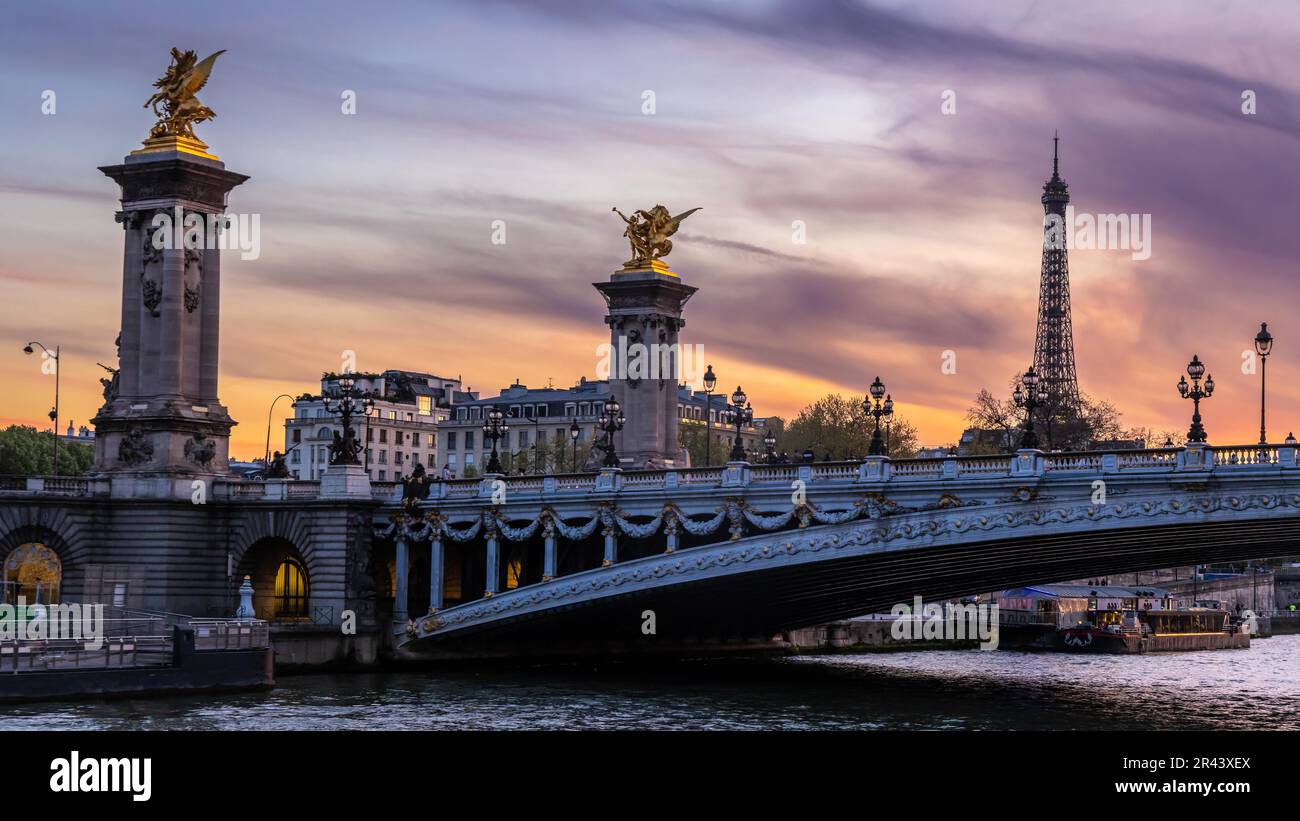 Evening atmosphere in the Seine in Paris with Pont Alexandre III bridge and Eiffel Tower, Paris, France Stock Photo