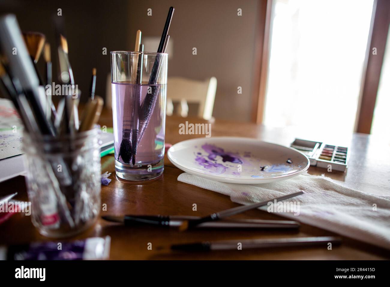 Art supplies and brushes on table top Stock Photo