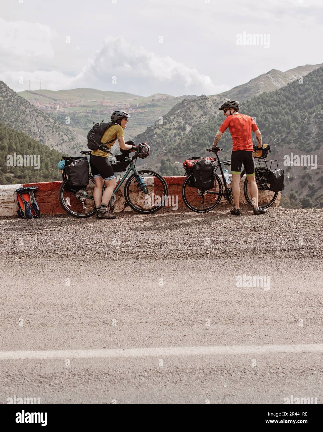 A couple of bike packers take a break while cycling through Morocco. Stock Photo