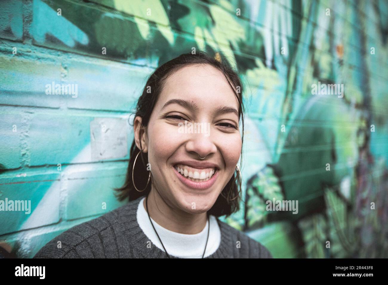 Multi ethnic woman with  toothy smile. Stock Photo