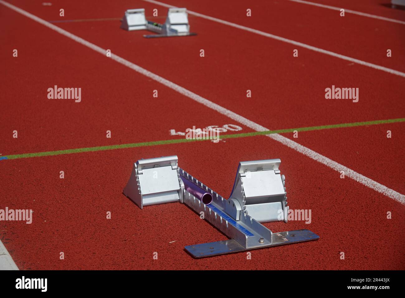 Close up of starting blocks at an athletics running track Stock Photo