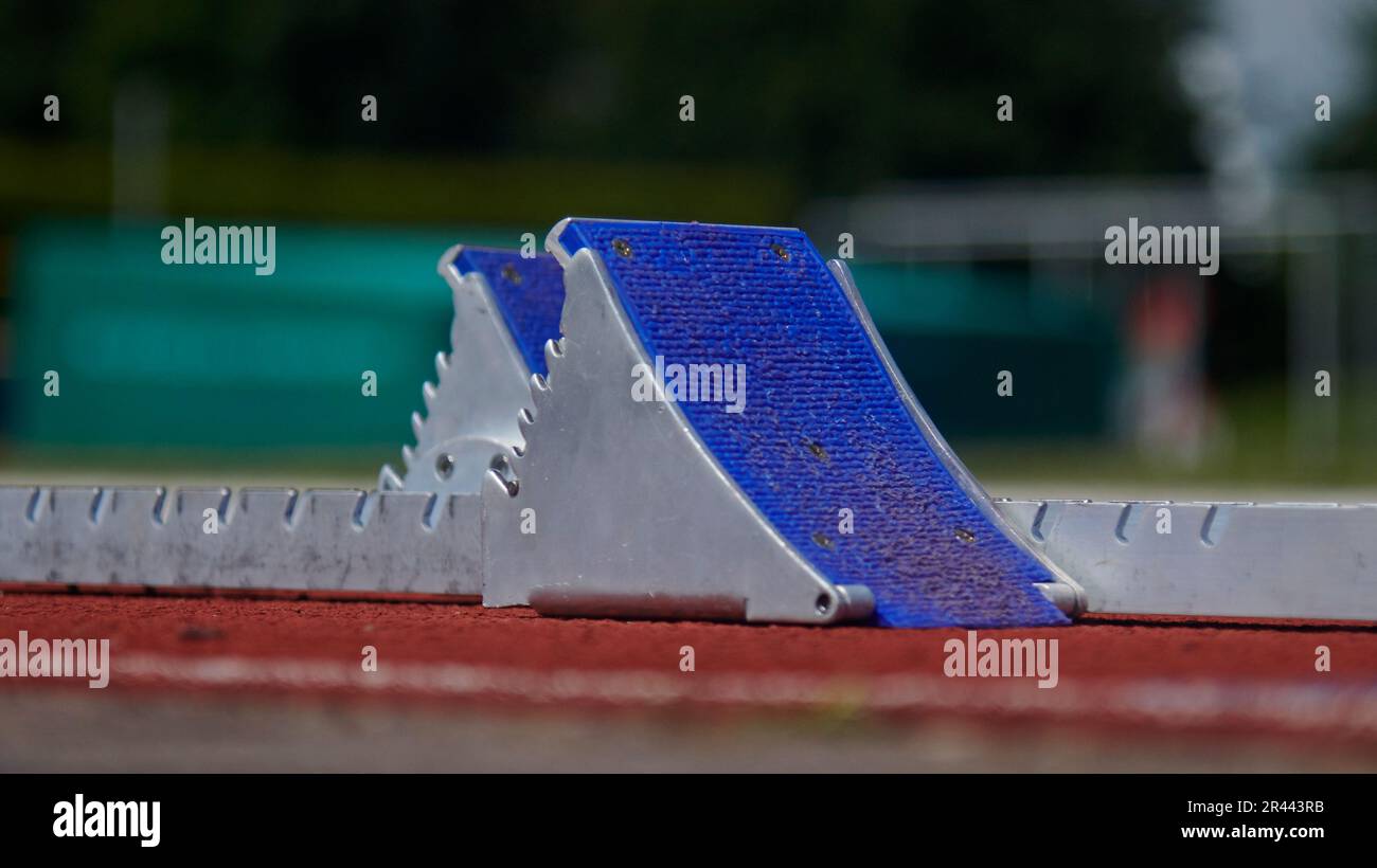 Close up of starting blocks at an athletics running track Stock Photo