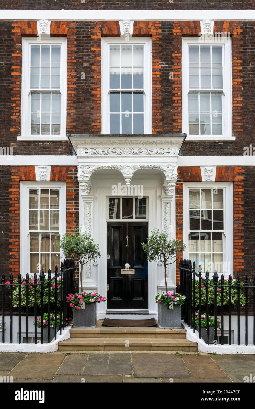 House with a wooden carved porch in the city of Westminster, London Stock Photo