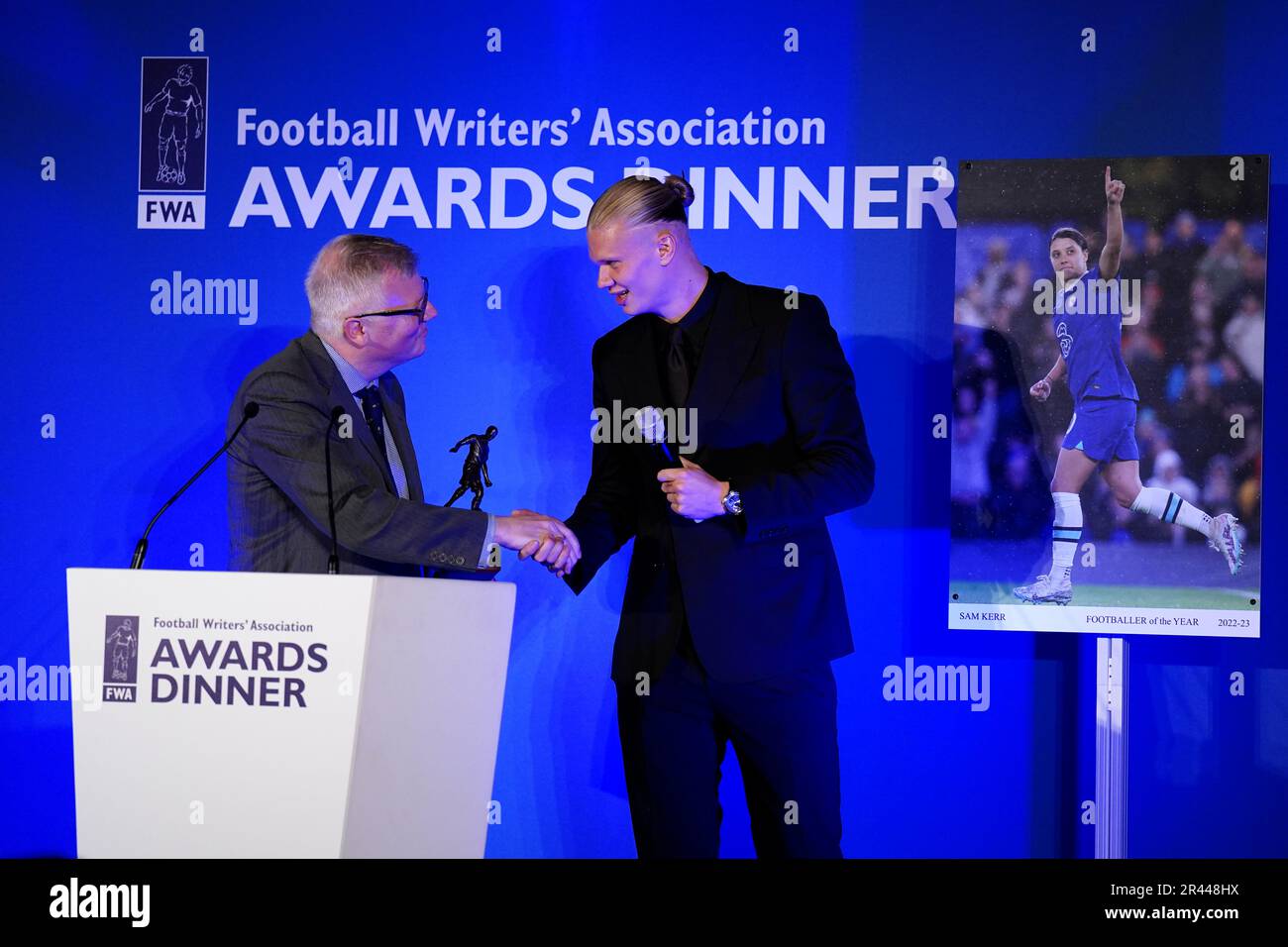 Erling Haaland with his FWA footballer of the year trophy after receiving his award from John Cross, chair of the FWA during the FWA Footballer of the Year awards held at the Landmark Hotel, London. Picture date: Thursday May 25, 2023. Stock Photo