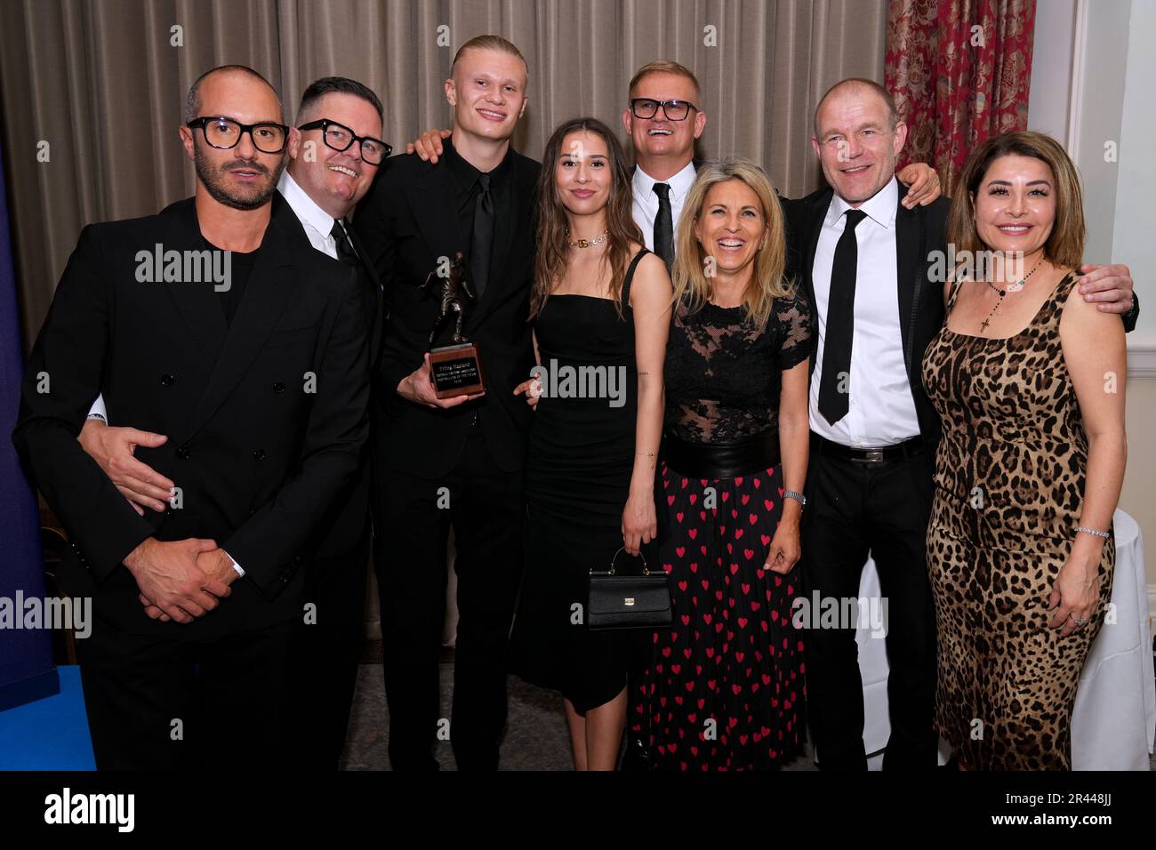 Erling Haaland (3rd left) with his FWA footballer of the year trophy alongside his family during the FWA Footballer of the Year awards held at the Landmark Hotel, London. Picture date: Thursday May 25, 2023. Stock Photo