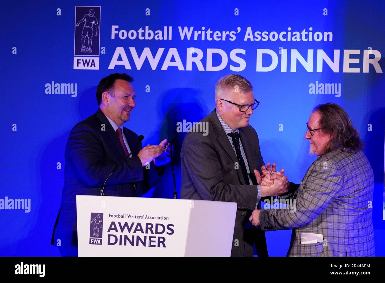 John Ley, (right) FWA membership secretary receiving his Ivan Sharpe Life Membership Award from John Cross (centre) Chair of the FWA during the FWA Footballer of the Year awards held at the Landmark Hotel, London. Picture date: Thursday May 25, 2023. Stock Photo