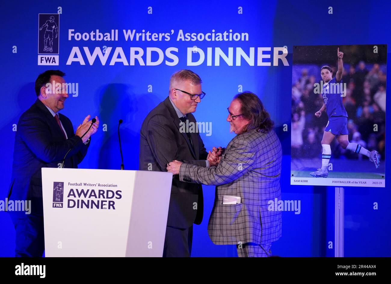 John Ley, (right) FWA membership secretary receiving his Ivan Sharpe Life Membership Award from John Cross (centre) Chair of the FWA during the FWA Footballer of the Year awards held at the Landmark Hotel, London. Picture date: Thursday May 25, 2023. Stock Photo