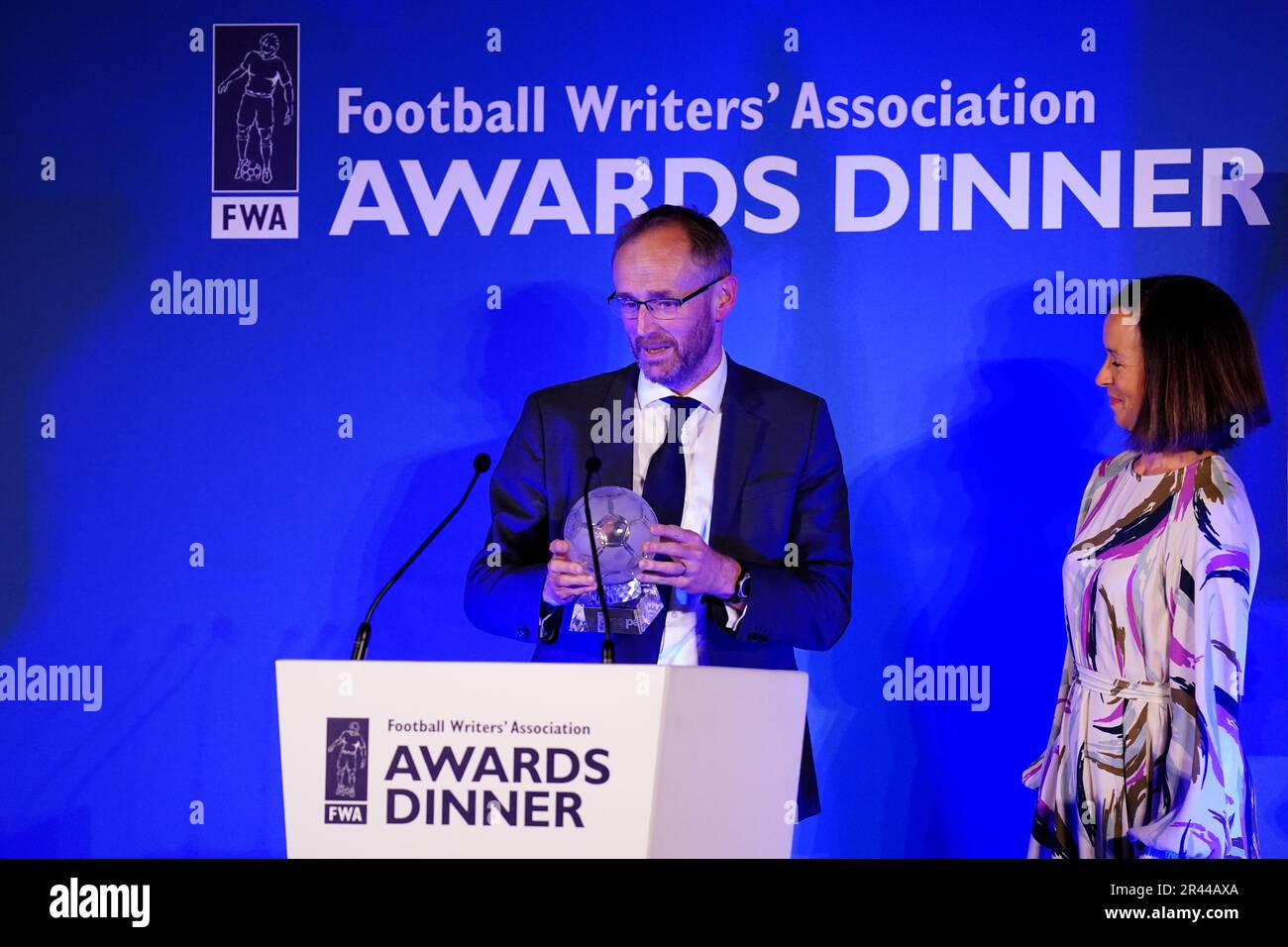 Kaat Vanderheyde (right) managing director of Brand and Sponsorship at FedEx Express Europe presents Rob Draper (centre) of The Mail on Sunday with the European Football Writer of the year award during the FWA Footballer of the Year awards held at the Landmark Hotel, London. Picture date: Thursday May 25, 2023. Stock Photo