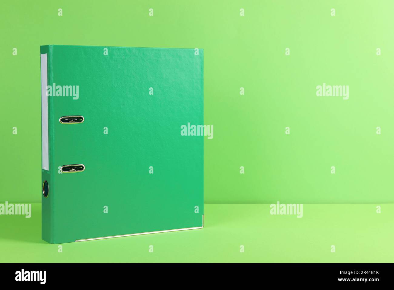 Office folder on light green background, space for text Stock Photo