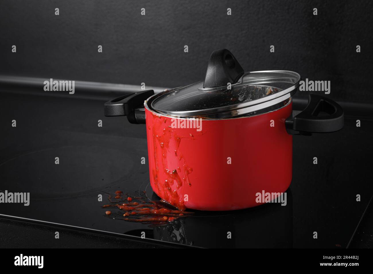 Dirty pot with lid on cooktop in kitchen, space for text Stock Photo ...