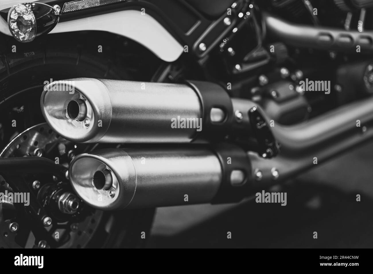 Motorcycle Closeup Customs Exhaust Pipes Big Muffler End Tip Dual Twin Out In Black And White Vintage Tone Stock Photo
