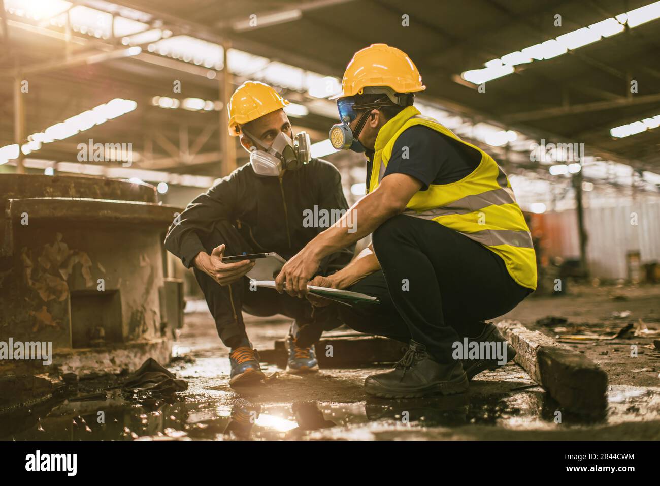 Industry environment impact inspector team work investigate danger chemical oil gas leak with safety face mask Stock Photo