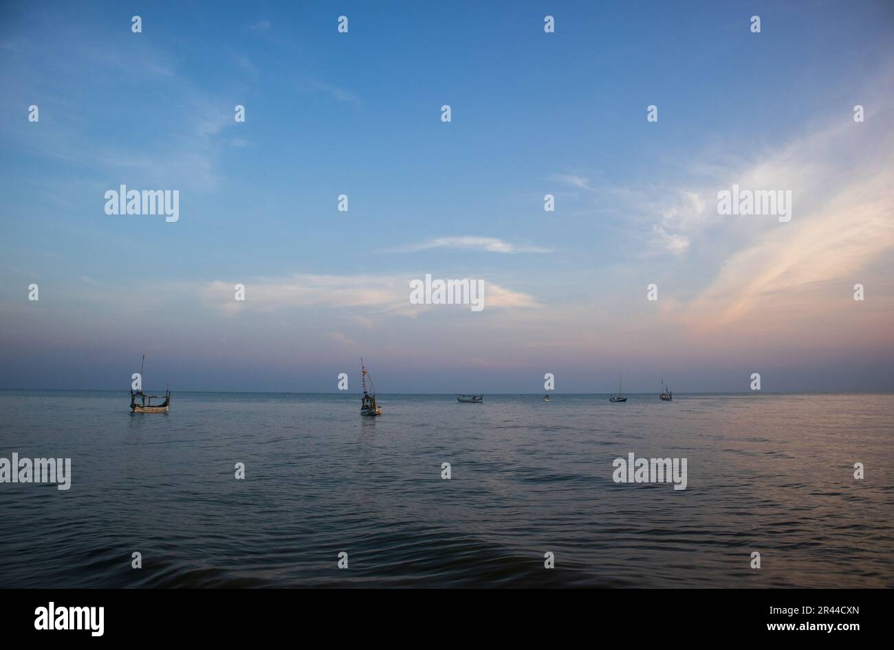 fishing boat lies in the sea in the morning Stock Photo - Alamy