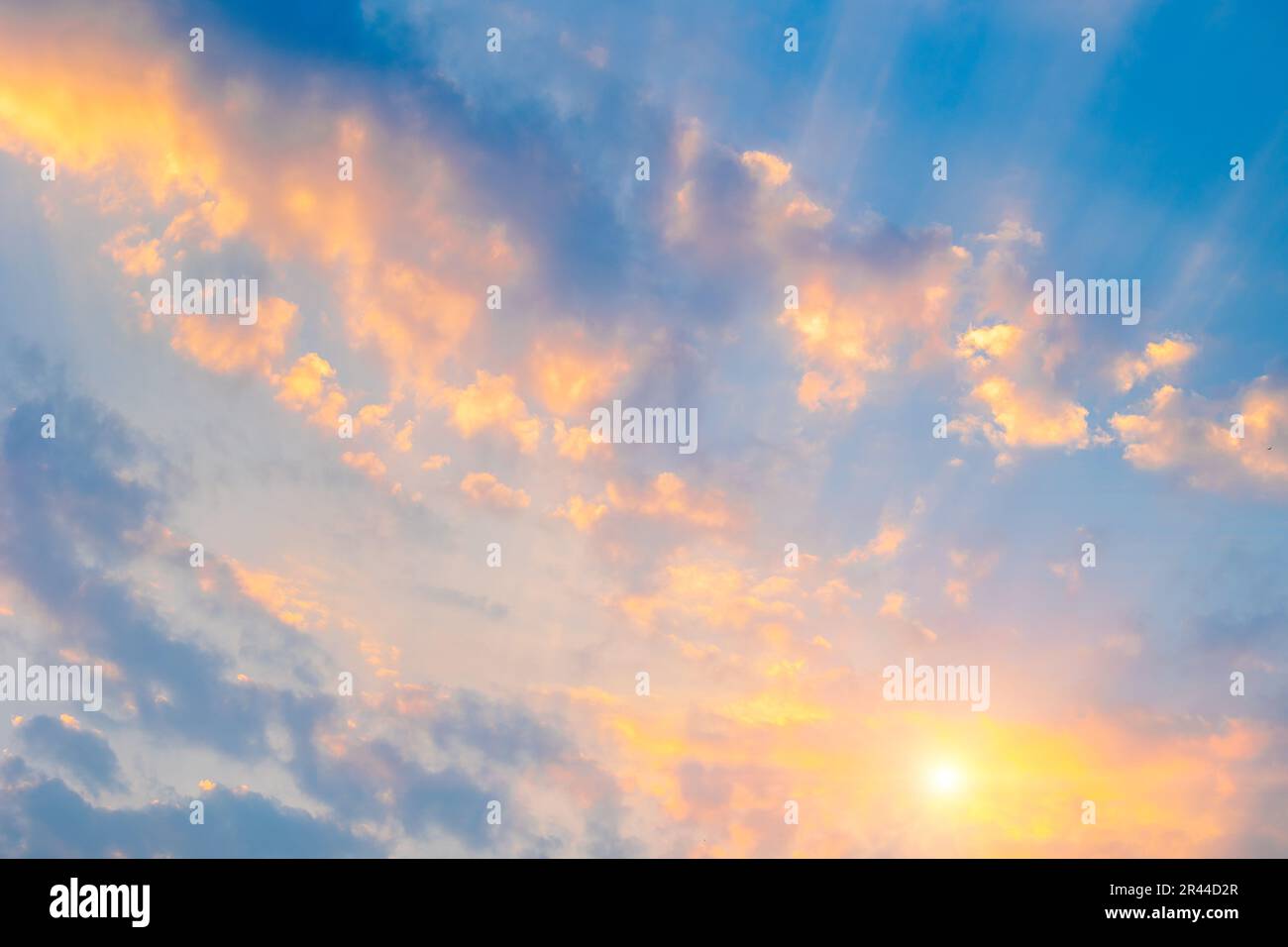 Beautiful sunset or sunrise morning day sky scatter clouds with dramatic light. Stock Photo