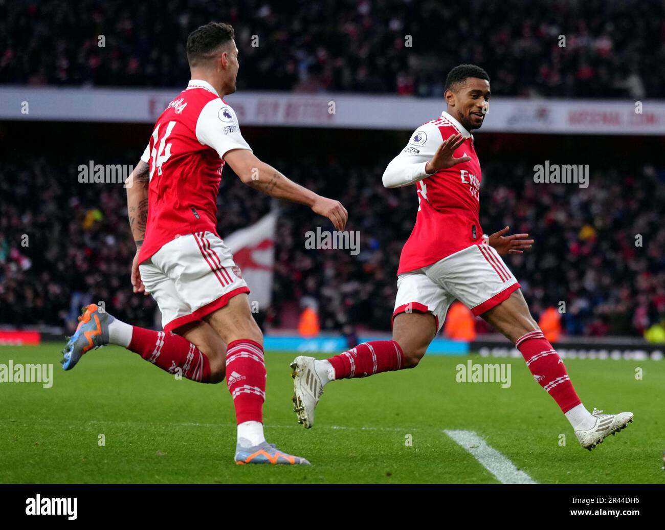 File photo dated 04-03-2023 of Arsenal's Reiss Nelson (right) celebrates scoring his sides third goal. One constant this season has been the division's ability to keep producing crazy finales. From Kane's equaliser at the death at Stamford Bridge in August to Reiss Nelson's heroics in Arsenal's thrilling 3-2 win over Bournemouth two months ago, you can always bet on stoppage-time drama. Issue date: Friday May 26, 2023. Stock Photo