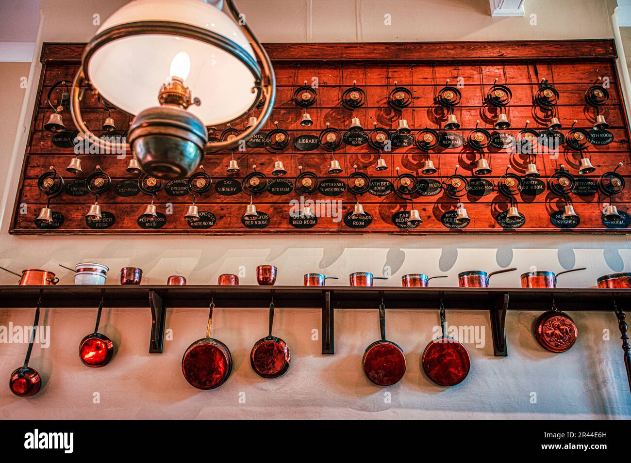 The bells, the bells. Servant bells in the kitchen at Palace House, Beaulieu, Hampshire, UK Stock Photo