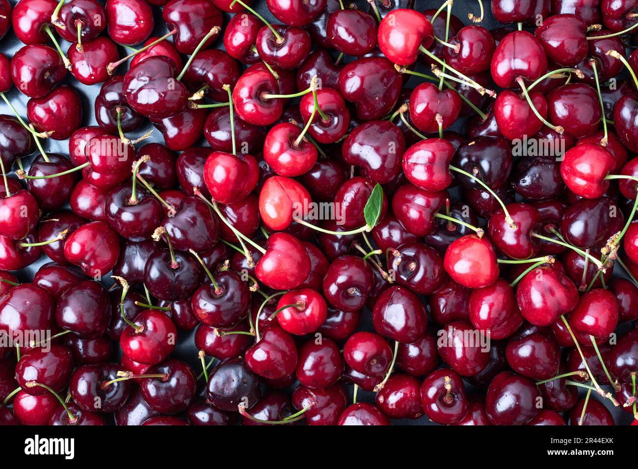 Set of red cherries in bulk. Red fruits rich in vitamins and healthy ...