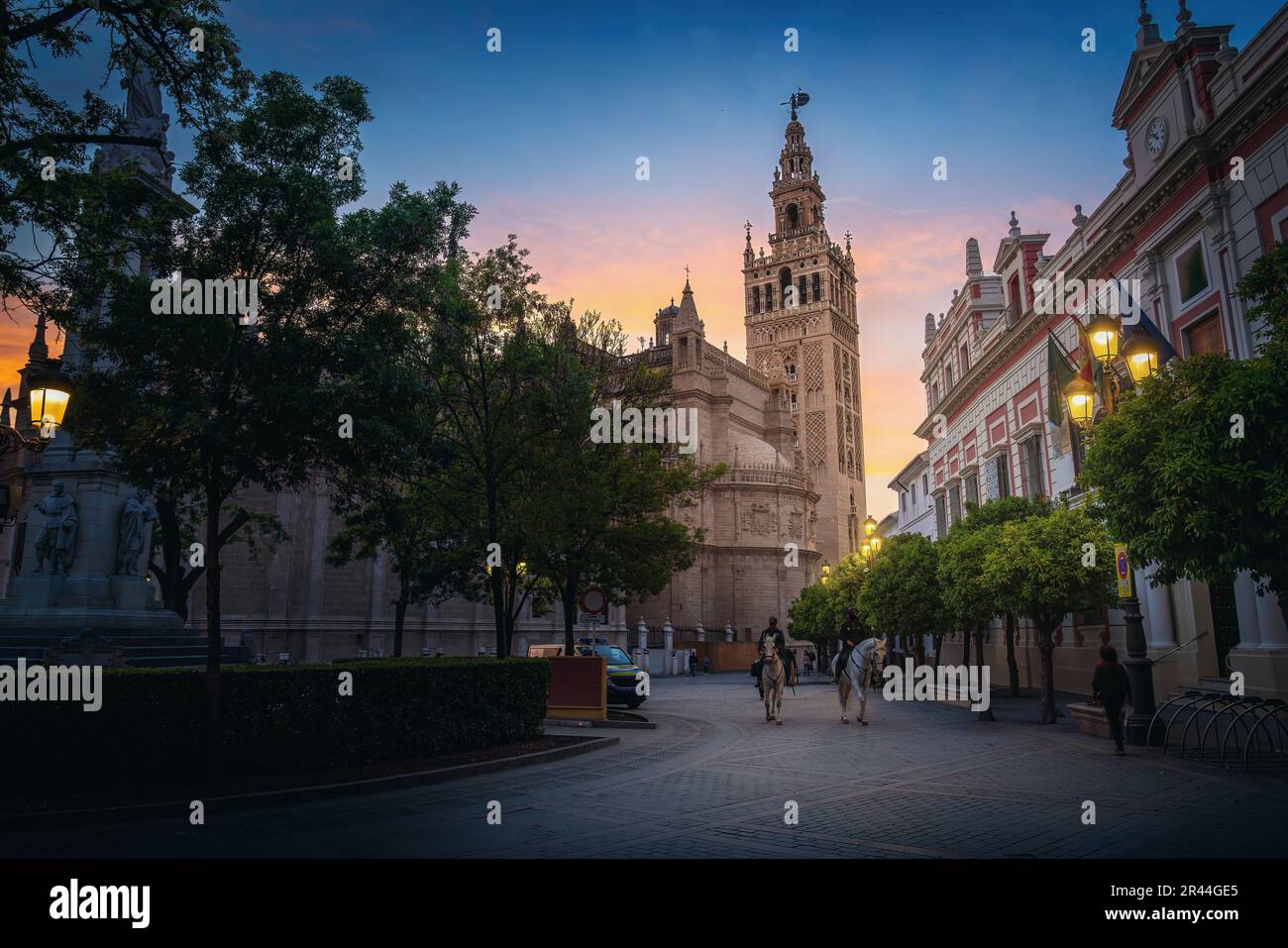 Seville Cathedral and Plaza del Triunfo at sunset - Seville, Andalusia, Spain Stock Photo