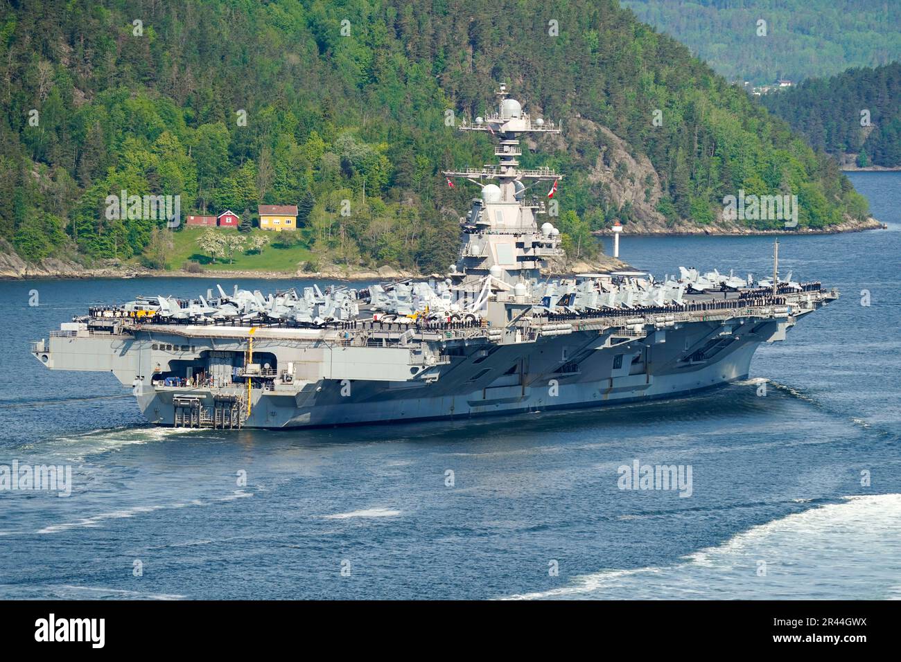 Moss 20230524.The American aircraft carrier USS Gerald R. Ford on its way into the Oslofjord, here at Droebak and Oscarsborg on Wednesday morning. The high island behind. The ship is the world's largest warship and will be in port in Oslo for four days. Photo: Terje Pedersen / NTB Stock Photo