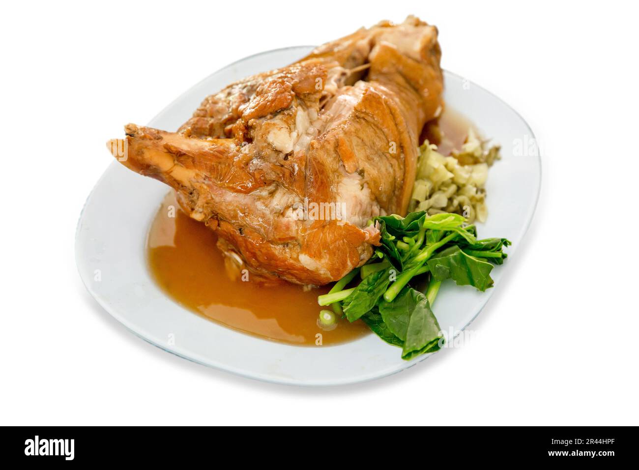 Die cut of Close up of chinese food pork knuckle in a plate on white