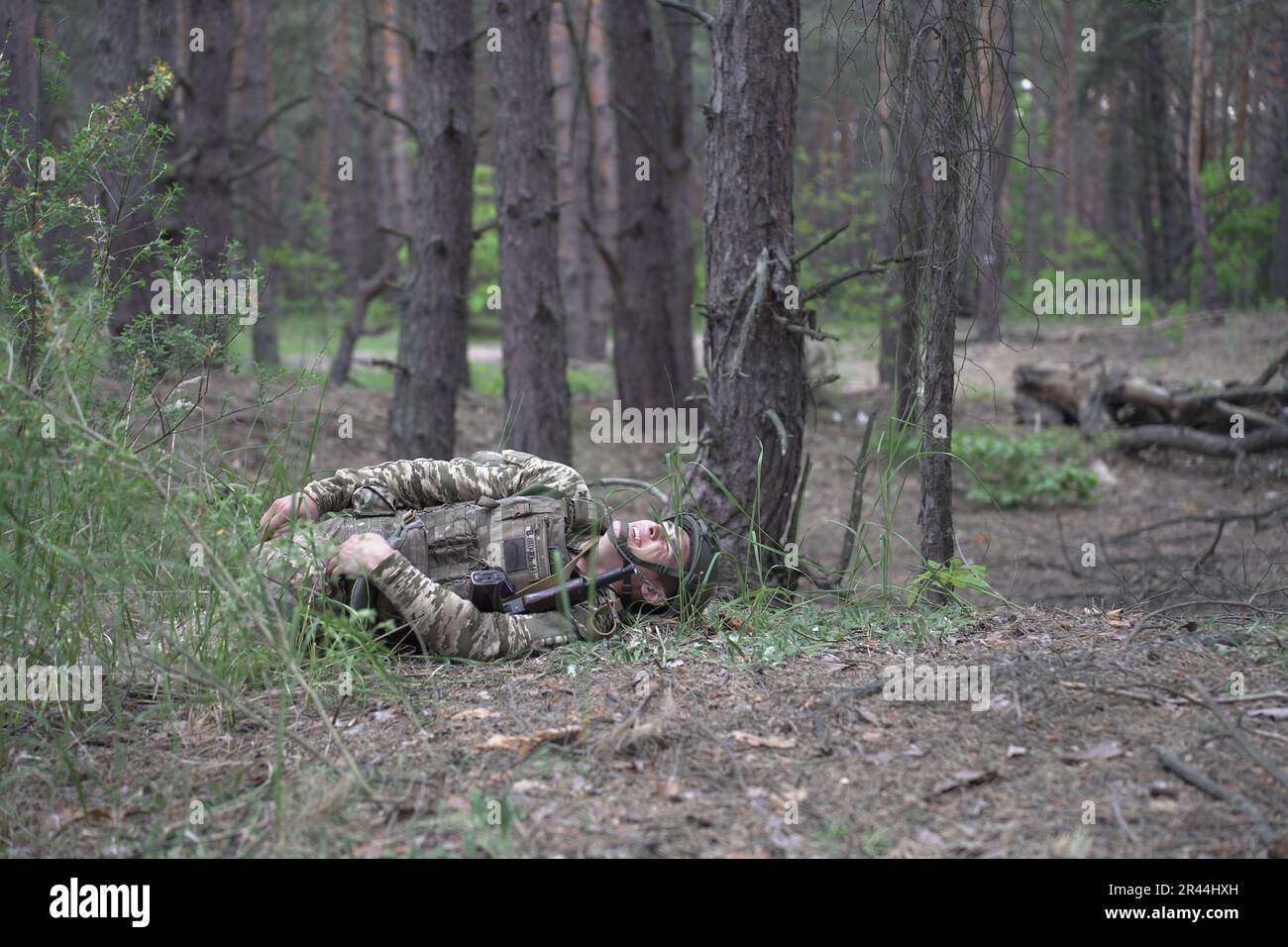 Soldiers of UkraineÕs Armed Forces Regular Infantry recieve intensive medical training from volunteers of the Prytula Foundation. Trainers from the foundation learn from experts in NATO-style TCCC Western medical training. Soldiers at the large military base simulate frontline conditions, living in the forest and digging trenches over long periods of time. Stock Photo