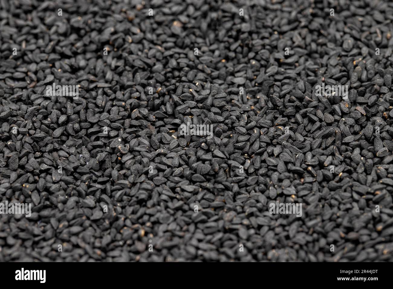 Pile of black cumin as background, spice or seasoning as background. Kalonji, nigella sativa, black cumin Stock Photo