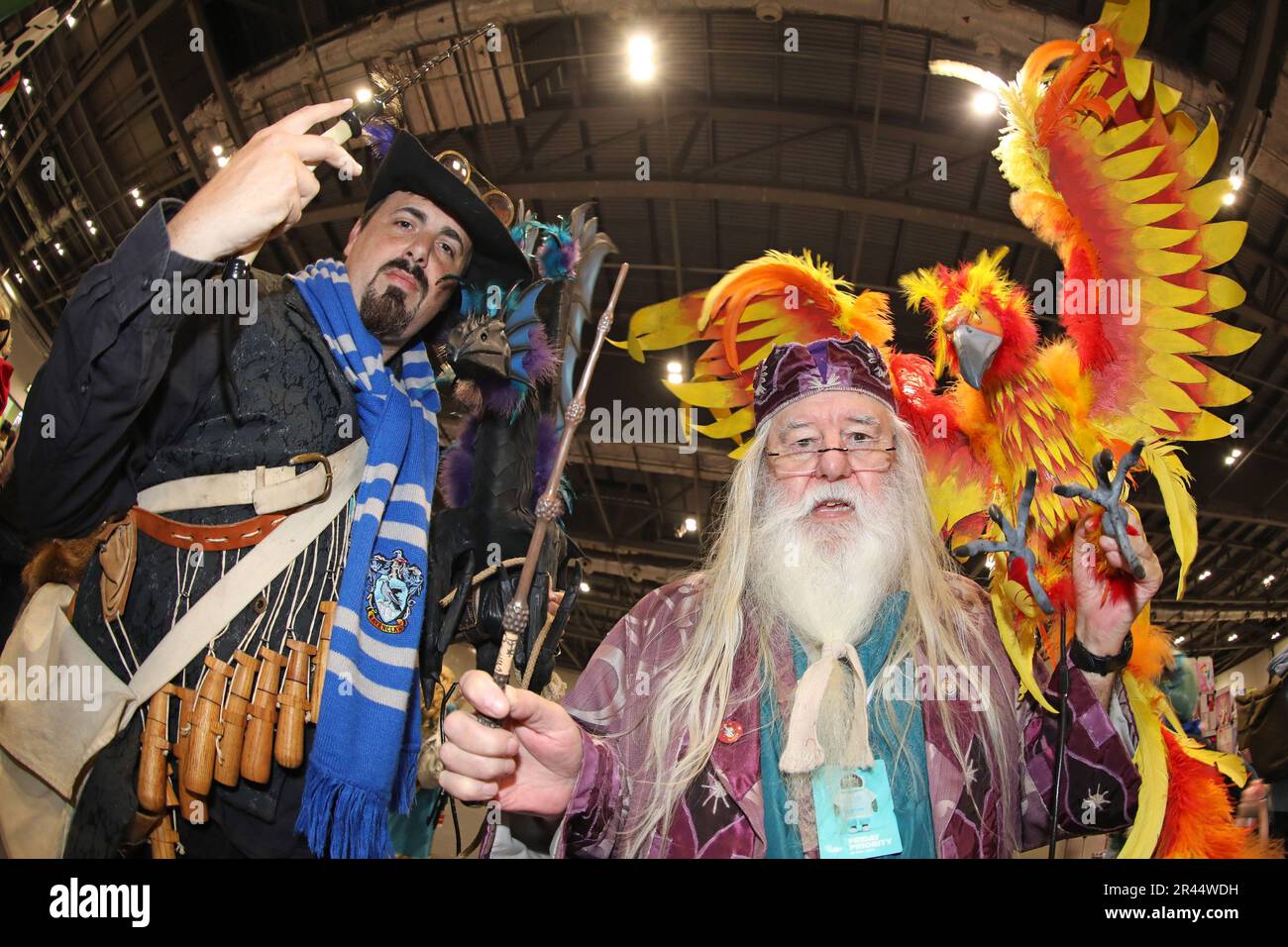 London, UK. 26th May, 2023. Participant dressed as Dumbledore from Harry Potter with Fawkes at MCM London Comic Con 2023 at Excel in London Credit: Paul Brown/Alamy Live News Stock Photo