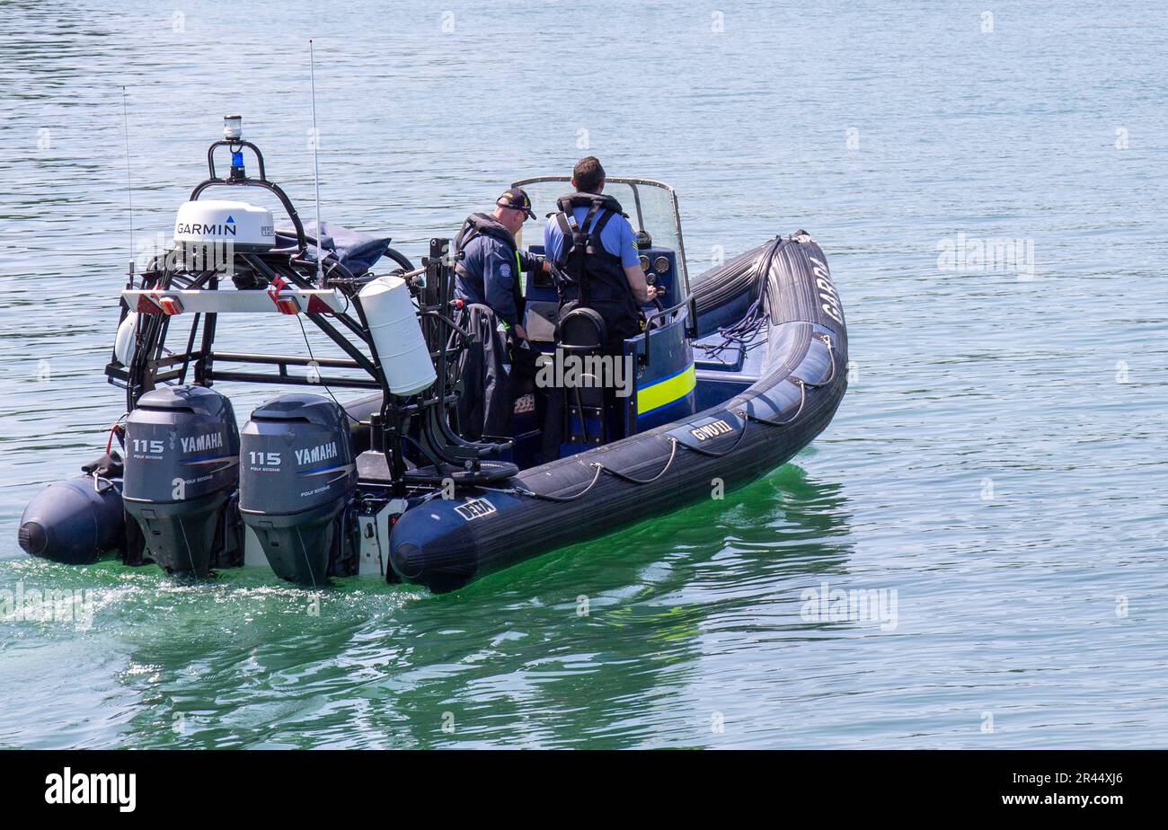 Glandore Harbour, West Cork, Ireland. Friday 26th May 2023 Members of the Garda Water Unit heading out of Glandore Harbour this afternoon to continue the search for the women missing since Tuesday in the Long Strand area. This unit has come down from Dublin to add to the assets already searching the sea in that area. Credit aphperspective/Alamy Live News Stock Photo