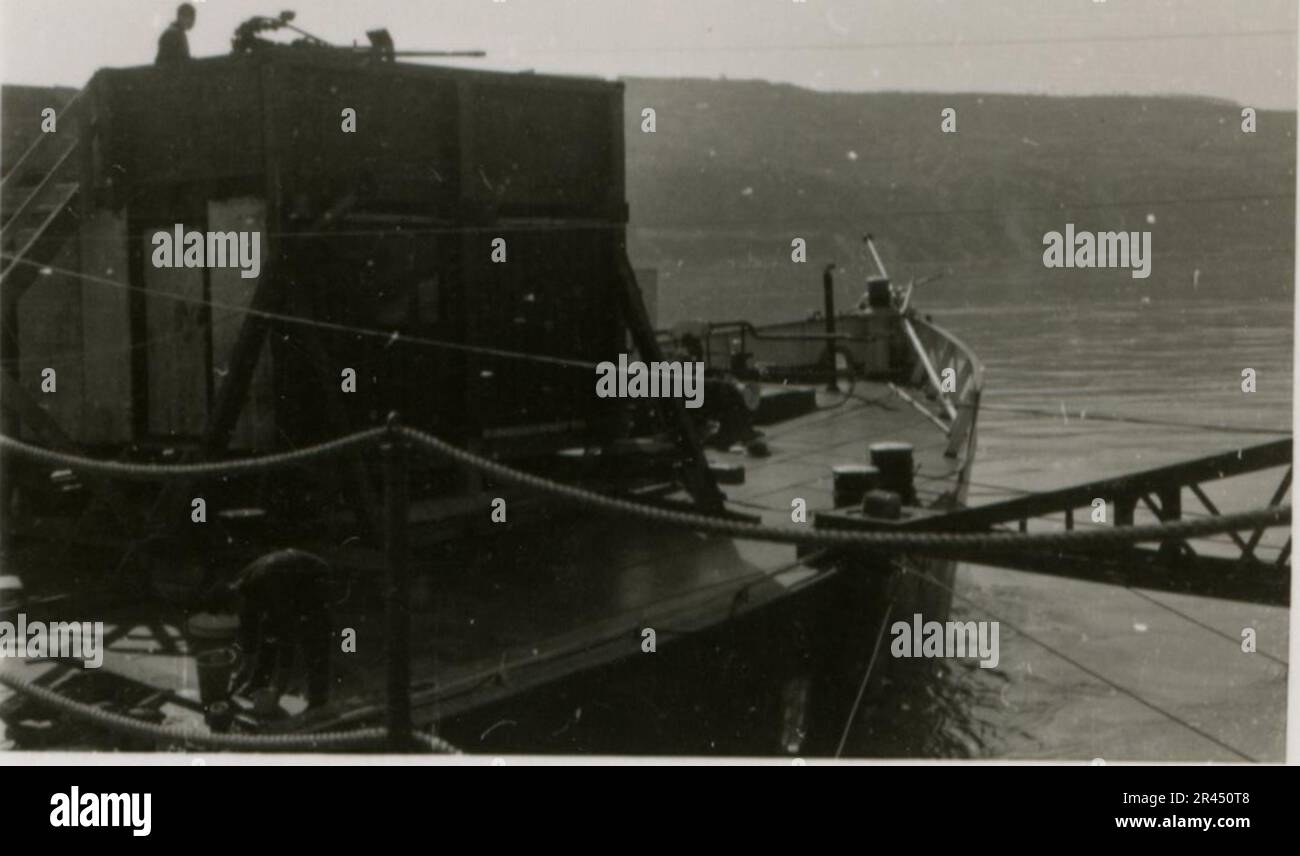 Gunter Alquen (Leibstandarte Adolf Hitler, Greece 1941), an SS photographer, documented Nazi atrocities in Greece during World War II. His lens captured the horror and suffering inflicted upon innocent civilians and resistance fighters.  Images of Sepp Dietrich, accompanied by officers, captured in photographs alongside soldiers, Greek soldiers and civilians, Greek countryside, buildings, pontoon bridge operations. Numerous vehicles bearing tactical symbols, along with the aftermath of destruction: ruined buildings, vehicles, equipment. Artillery shelling and scenes depicting a war-torn countr Stock Photo