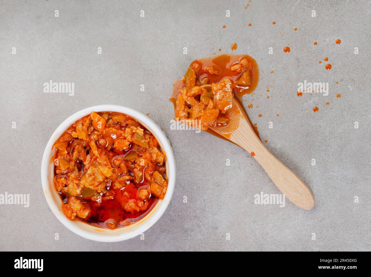 Traditional South African Mango Atchar or Achar on mottled gray with ...