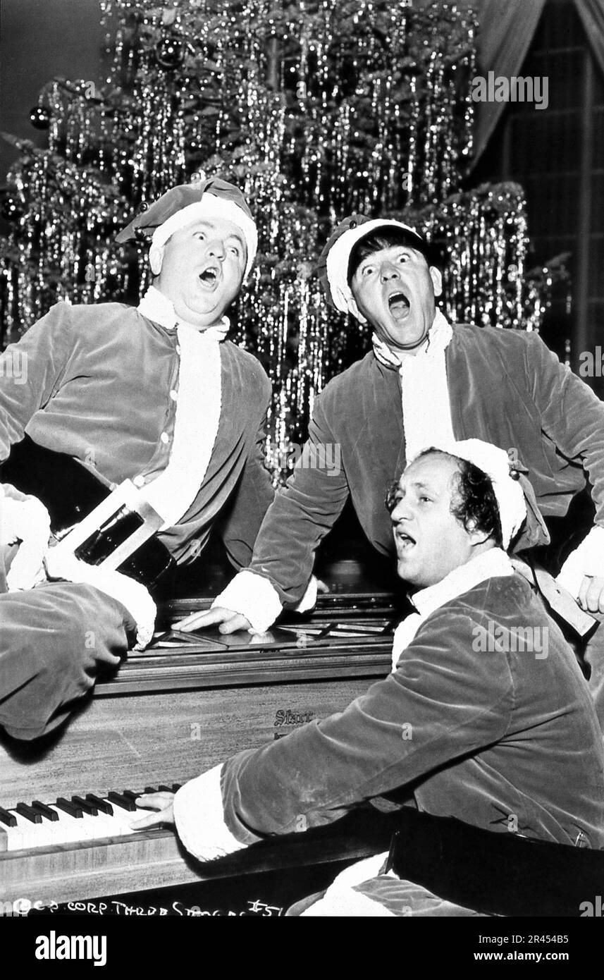 MOE HOWARD LARRY FINE CURLY HOWARD  THE THREE STOOGES dressed as Santa Claus / Father Christmas 1937 publicity for Columbia Pictures Stock Photo