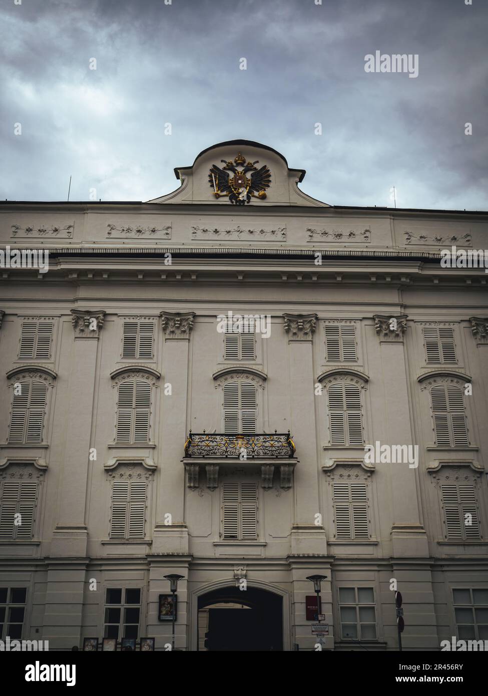 Habsburg palace Hofburg front in Innsbruck with balcony and windows moody weather cloudy sky summer Stock Photo