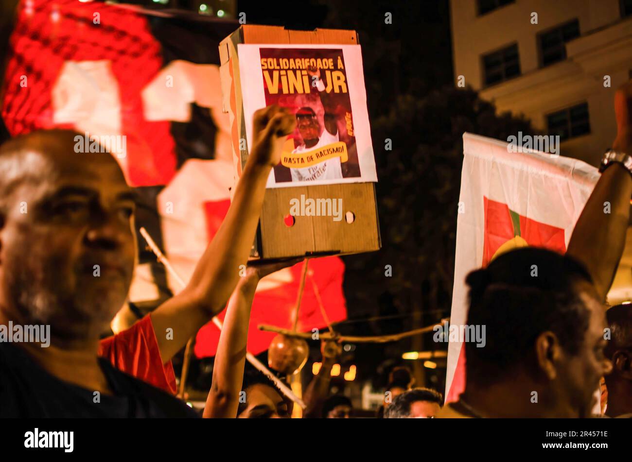 A protester holds a picture of Vinicius J?nior during the demonstration. Manifestation in Rio de Janeiro city, in solidarity to Real Madrid´s player Vinícius Júnior, who suffered racism in Spain during a game against Valencia team, on Sunday (21). Vinícius Jr. was a victim of racism and violence, when he was called out as ‘mono' (translation to ‘monkey') by several football fans and opponent players while the match happened. He was later kicked out of the match. Vinicius Junior already has eight cases of racism still in process by La Liga. (Photo by Ramon Vellasco/SOPA Images/Sipa USA) Stock Photo