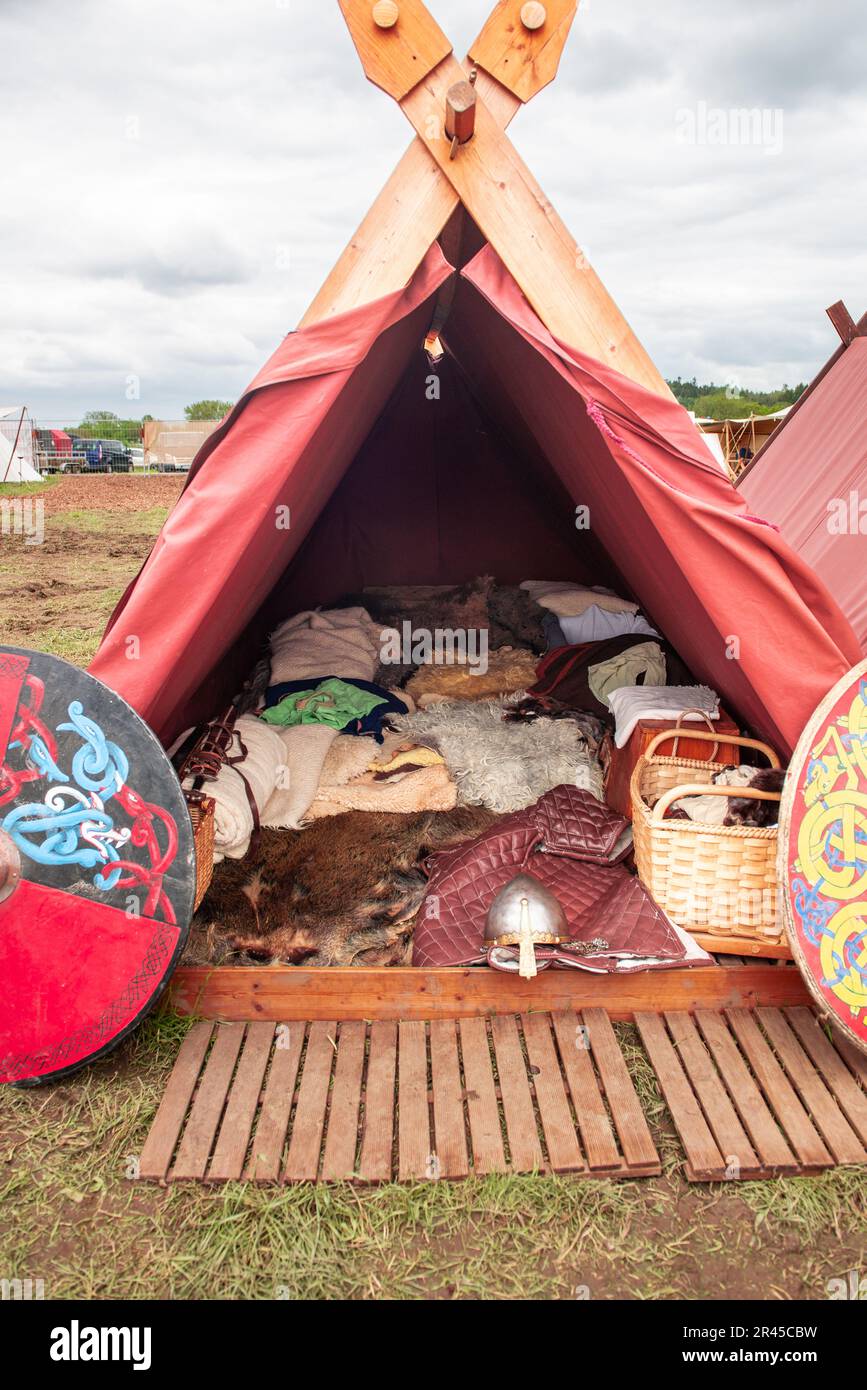 Bedding and clothes lie inside a tent during a medieval festival Stock Photo Alamy