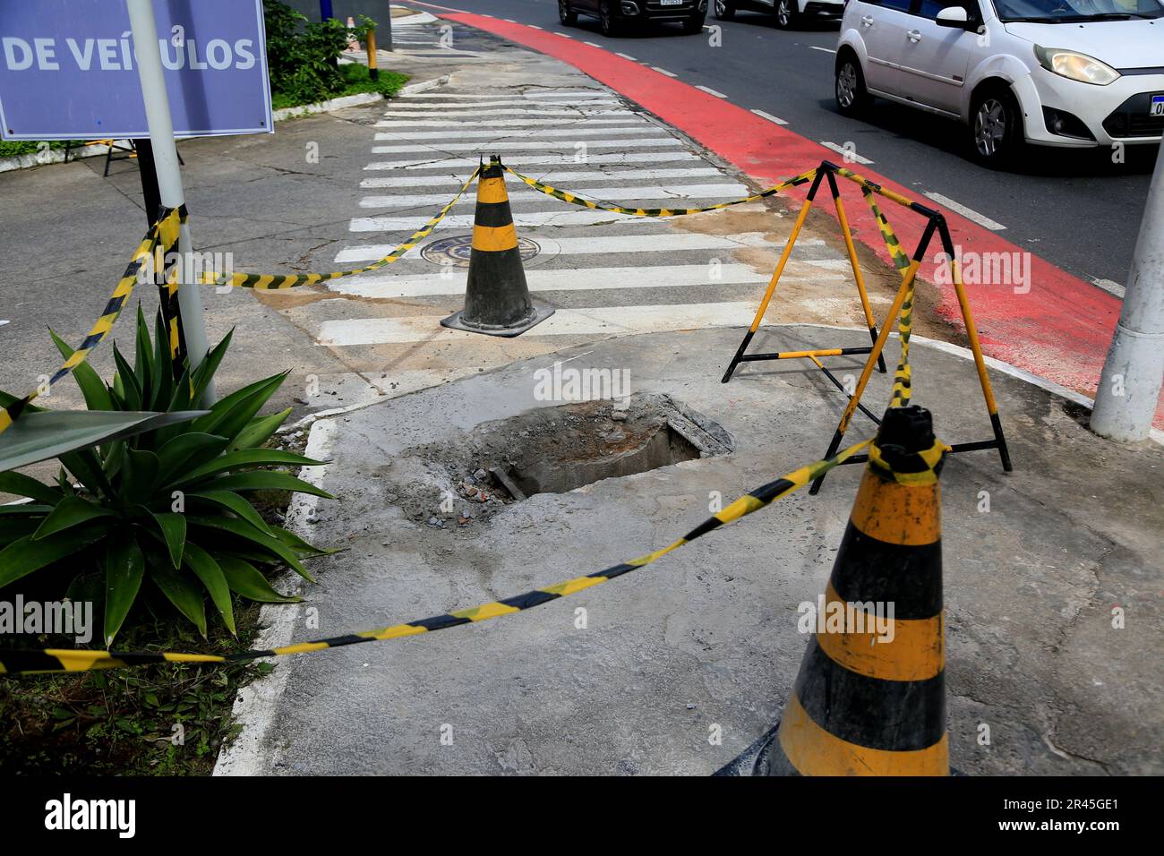 salvador, bahia, brazil may 16, 2023 cone and safety tape local mark with hole on the